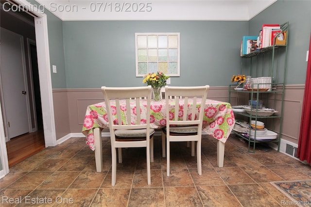 483 Rochdale Dr S, Rochester Hills, MI 48309 - dining space with stone finish floors and a wainscoted wall