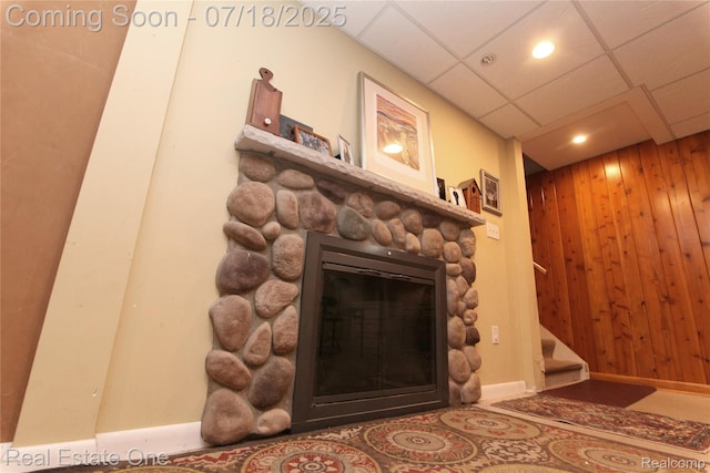 483 Rochdale Dr S, Rochester Hills, MI 48309 - detailed view of a stone fireplace, wood walls, recessed lighting, and a drop ceiling