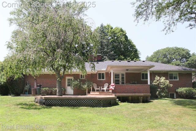 483 Rochdale Dr S, Rochester Hills, MI 48309 - back of house featuring a lawn, a wooden deck, and brick siding