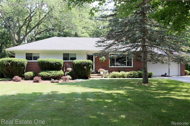483 Rochdale Dr S, Rochester Hills, MI 48309 - single story home with brick siding, a garage, board and batten siding, and a front yard