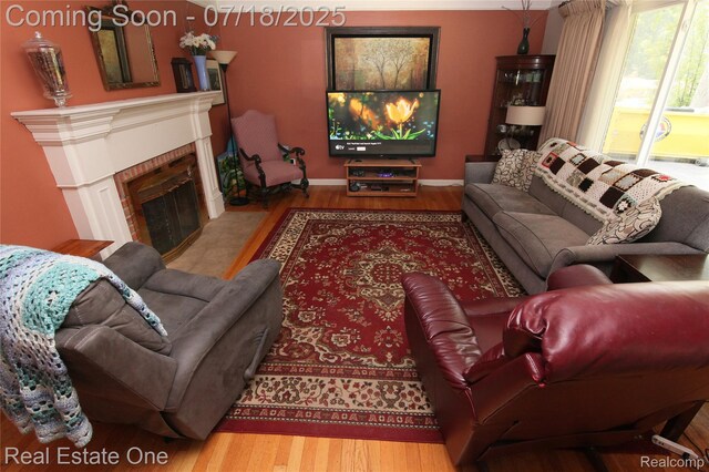 483 Rochdale Dr S, Rochester Hills, MI 48309 - living room featuring wood finished floors and a fireplace