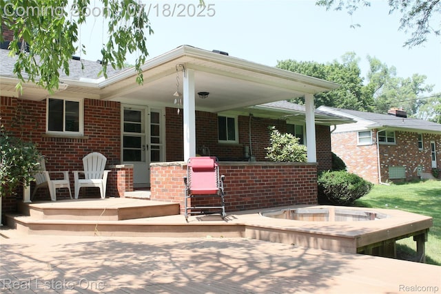 483 Rochdale Dr S, Rochester Hills, MI 48309 - back of property featuring brick siding and a porch