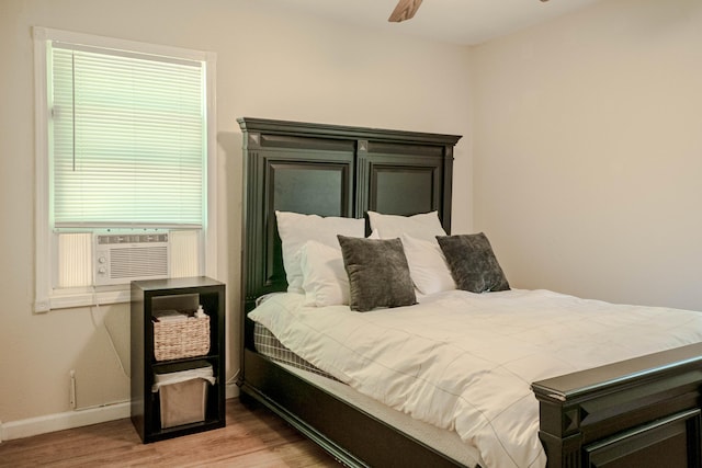 935 N Ave, Battle Creek, MI 49017 - bedroom featuring wood finished floors, cooling unit, and a ceiling fan