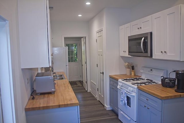 93402 Lee Dr Unit 1, Dowagiac, MI 49047 - kitchen with wood counters, white appliances, recessed lighting, dark wood-type flooring, and white cabinetry