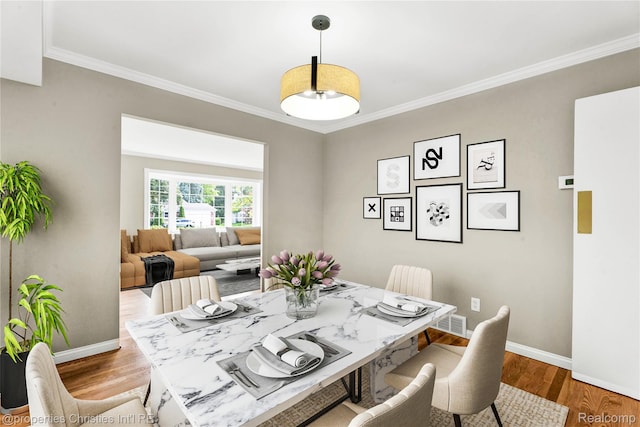 4770 Hedgewood Dr, Bloomfield Hills, MI 48301 - dining room featuring crown molding and wood finished floors