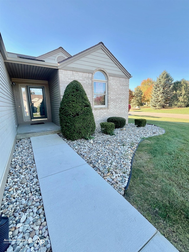 9330 Pinecrest Ct, Davison, MI 48423 - entrance to property with brick siding and a lawn