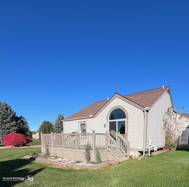 9330 Pinecrest Ct, Davison, MI 48423 - rear view of house with a yard, a wooden deck, and roof with shingles