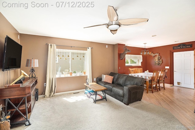 4420 Pinedale Ave, Clarkston, MI 48346 - carpeted living area featuring ceiling fan and baseboards