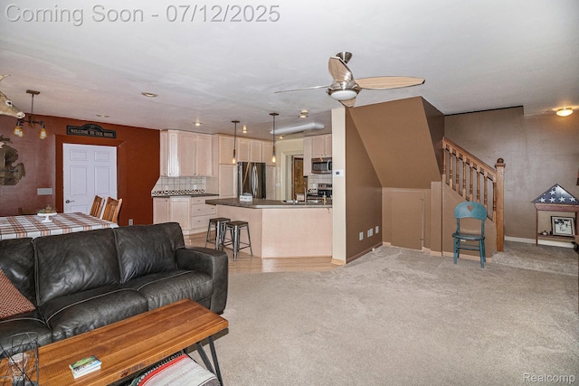 4420 Pinedale Ave, Clarkston, MI 48346 - living area with a ceiling fan, stairs, and light colored carpet