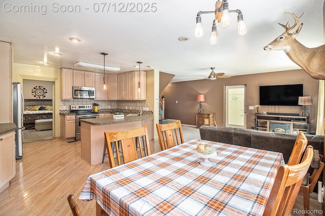 4420 Pinedale Ave, Clarkston, MI 48346 - dining area with light wood-type flooring and ceiling fan