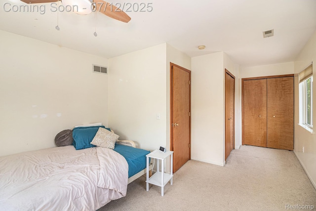 4420 Pinedale Ave, Clarkston, MI 48346 - bedroom featuring light carpet, ceiling fan, and multiple closets