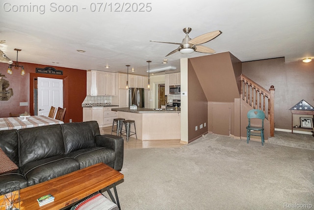 4420 Pinedale Ave, Clarkston, MI 48346 - living area featuring ceiling fan, light colored carpet, and stairs