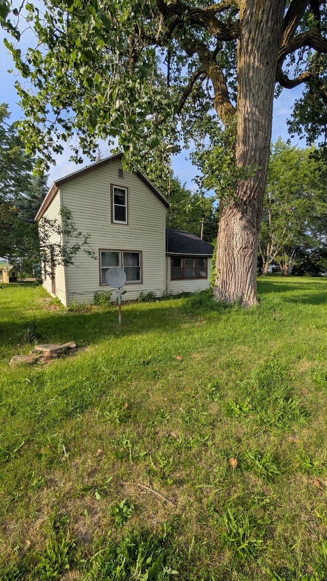6596 Hillsinger St, Elwell, MI 48832 - back of property featuring a lawn