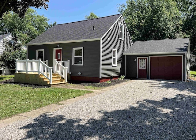 1999 Harold St, Adrian, MI 49221 - view of front of house featuring roof with shingles, an attached garage, and driveway