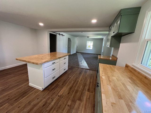 1999 Harold St, Adrian, MI 49221 - kitchen with wood counters, dark wood-style floors, recessed lighting, and a kitchen island