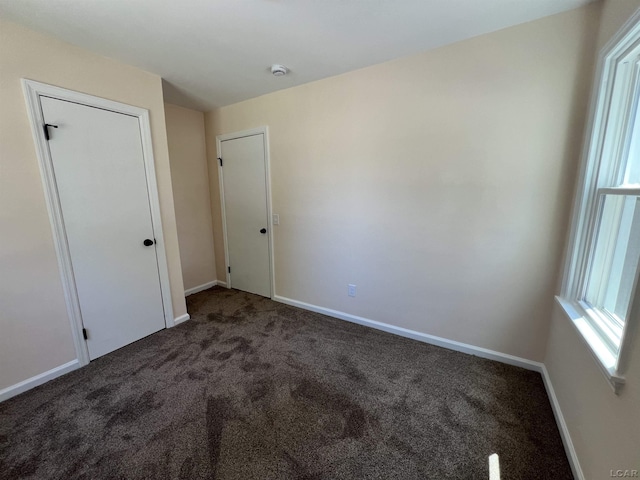 1999 Harold St, Adrian, MI 49221 - unfurnished bedroom featuring carpet floors and baseboards