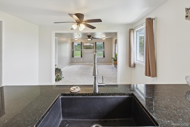 1612 Fischer Dr, Saginaw, MI 48601 - kitchen view of ceiling fan and dark stone counters