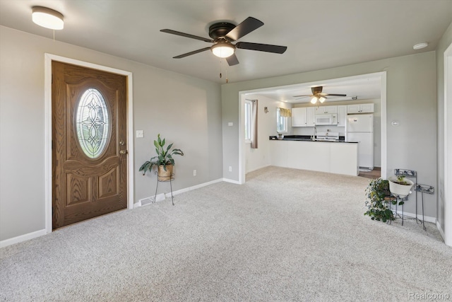 1612 Fischer Dr, Saginaw, MI 48601 - carpeted entrance foyer featuring a ceiling fan and baseboards