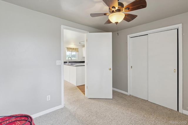 1612 Fischer Dr, Saginaw, MI 48601 - unfurnished bedroom featuring carpet floors, a closet, and ceiling fan