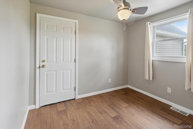 1612 Fischer Dr, Saginaw, MI 48601 - empty room with wood finished floors and ceiling fan