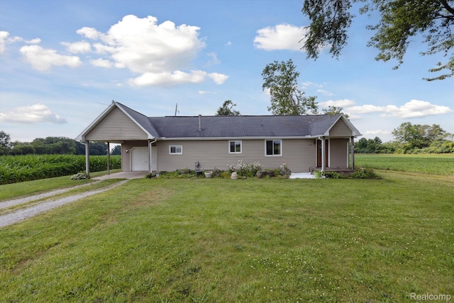 1612 Fischer Dr, Saginaw, MI 48601 - view of front facade with driveway, an attached garage, and a front lawn