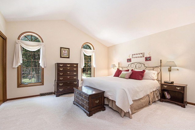 1410 Rothbury Dr NE, Grand Rapids, MI 49505 - bedroom featuring light carpet, lofted ceiling, and multiple windows