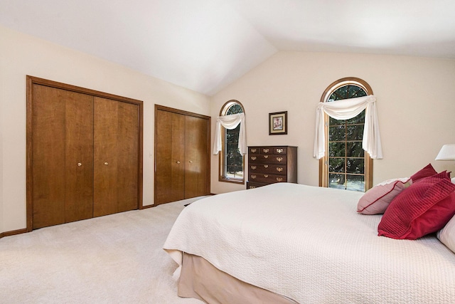 1410 Rothbury Dr NE, Grand Rapids, MI 49505 - bedroom with multiple closets, carpet, and lofted ceiling