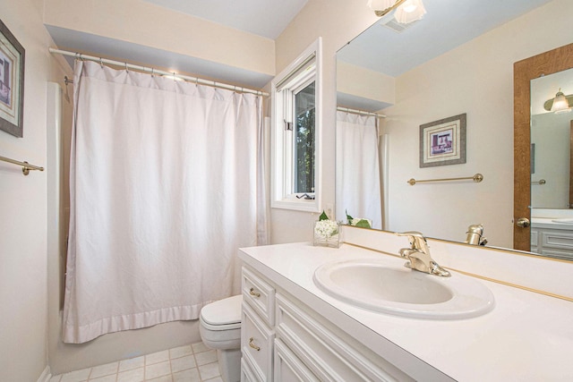 1410 Rothbury Dr NE, Grand Rapids, MI 49505 - bathroom featuring vanity, shower / bath combo with shower curtain, and tile patterned flooring