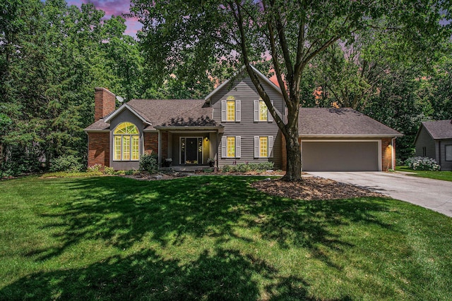 1410 Rothbury Dr NE, Grand Rapids, MI 49505 - traditional home with concrete driveway, an attached garage, a chimney, a yard, and a shingled roof