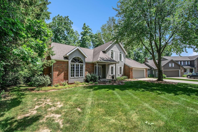 1410 Rothbury Dr NE, Grand Rapids, MI 49505 - view of front facade featuring a garage, brick siding, driveway, and a front lawn