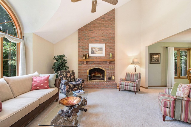 1410 Rothbury Dr NE, Grand Rapids, MI 49505 - living room featuring carpet, ceiling fan, a fireplace, and high vaulted ceiling