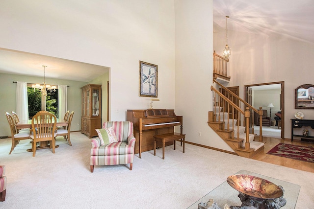1410 Rothbury Dr NE, Grand Rapids, MI 49505 - living room with a chandelier, a high ceiling, carpet flooring, and stairway