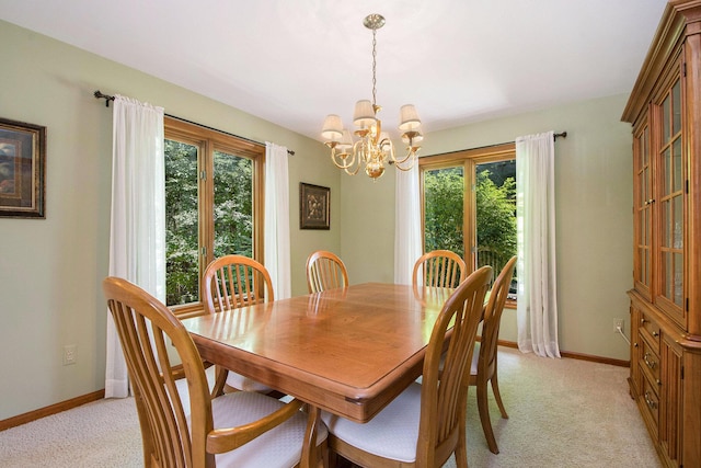 1410 Rothbury Dr NE, Grand Rapids, MI 49505 - dining space featuring a chandelier and light colored carpet