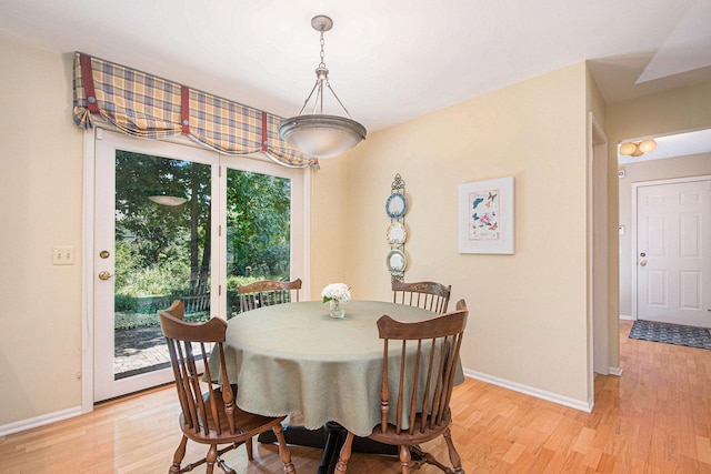 1410 Rothbury Dr NE, Grand Rapids, MI 49505 - dining space featuring light wood-style floors and baseboards