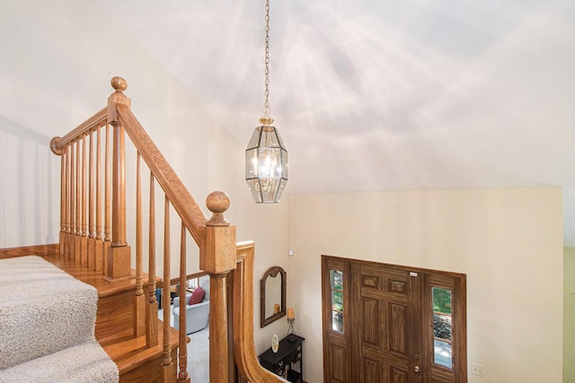 1410 Rothbury Dr NE, Grand Rapids, MI 49505 - foyer featuring a chandelier, carpet flooring, and stairway