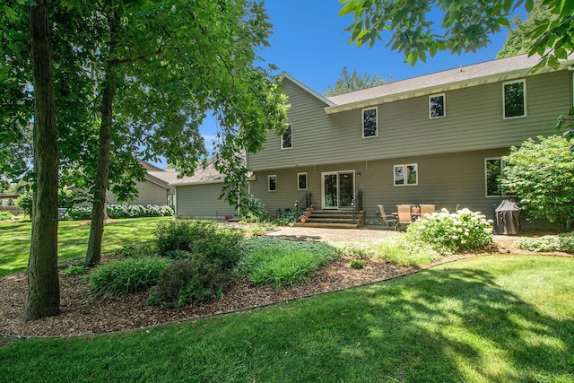 1410 Rothbury Dr NE, Grand Rapids, MI 49505 - back of property featuring a yard and entry steps