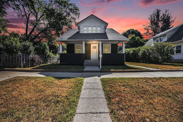 2028 Rowe Ave NE, Grand Rapids, MI 49505 - bungalow-style house featuring roof with shingles and a porch