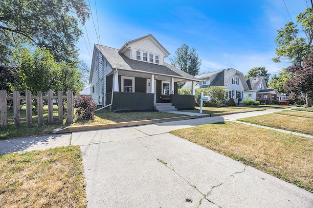 2028 Rowe Ave NE, Grand Rapids, MI 49505 - bungalow-style house with covered porch and a shingled roof
