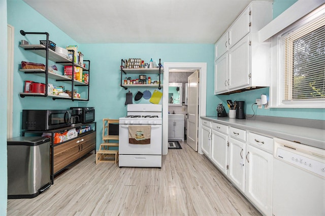 2028 Rowe Ave NE, Grand Rapids, MI 49505 - kitchen with white appliances, white cabinetry, light wood-style flooring, and open shelves