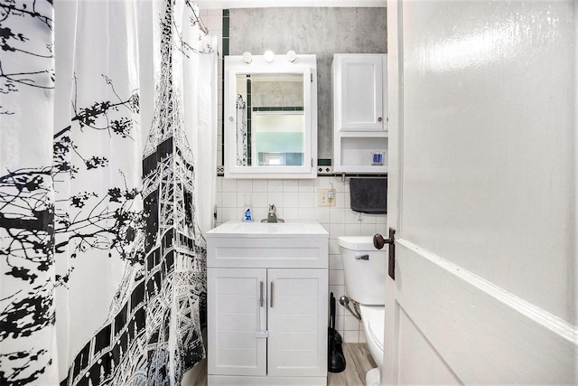 2028 Rowe Ave NE, Grand Rapids, MI 49505 - bathroom with vanity, tile walls, tasteful backsplash, and curtained shower