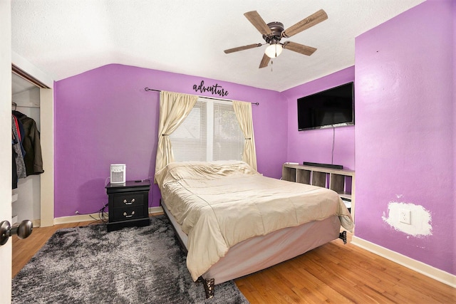 2028 Rowe Ave NE, Grand Rapids, MI 49505 - bedroom featuring wood finished floors, lofted ceiling, ceiling fan, and a textured ceiling