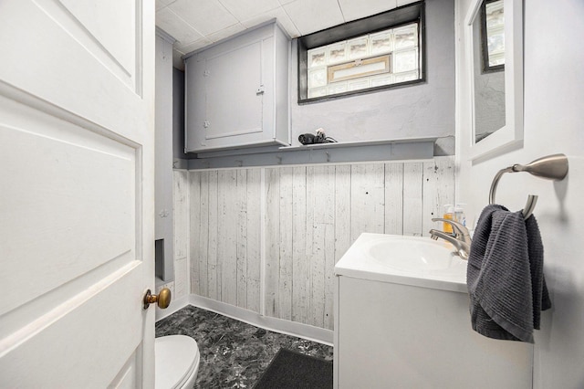 2028 Rowe Ave NE, Grand Rapids, MI 49505 - half bath with vanity and wood walls
