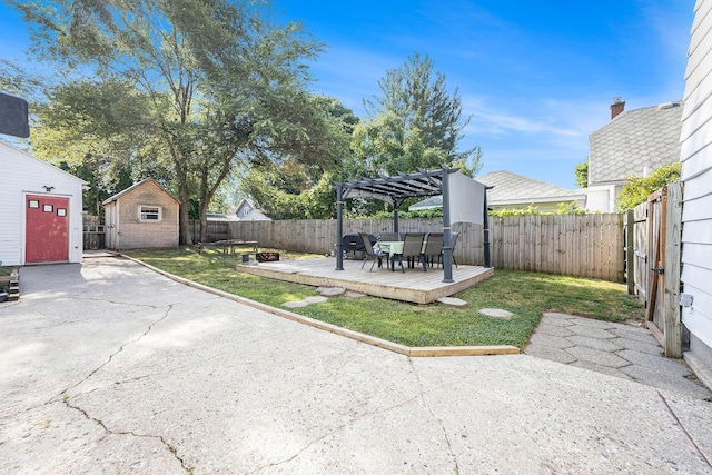 2028 Rowe Ave NE, Grand Rapids, MI 49505 - fenced backyard featuring a pergola, a deck, a storage shed, and a patio area