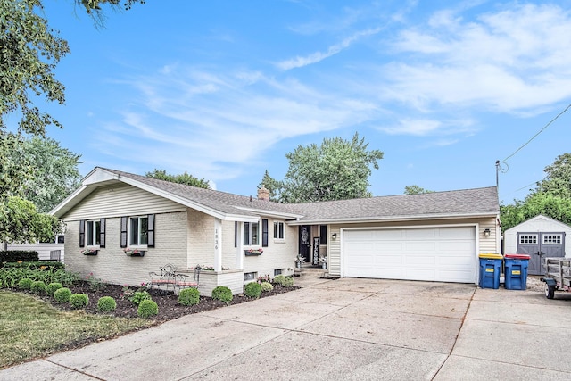 1836 Ridgewood Ave SE, Grand Rapids, MI 49506 - single story home featuring a garage, concrete driveway, brick siding, and a chimney