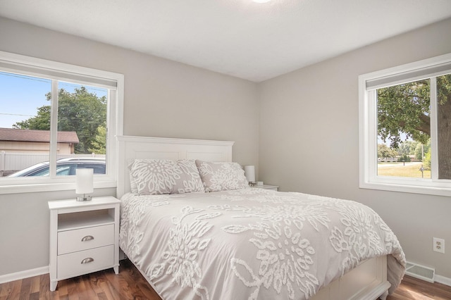 1836 Ridgewood Ave SE, Grand Rapids, MI 49506 - bedroom with multiple windows and dark wood finished floors