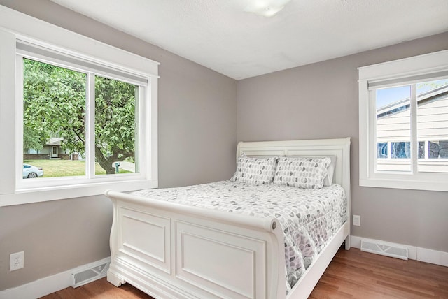 1836 Ridgewood Ave SE, Grand Rapids, MI 49506 - bedroom featuring multiple windows and light wood finished floors
