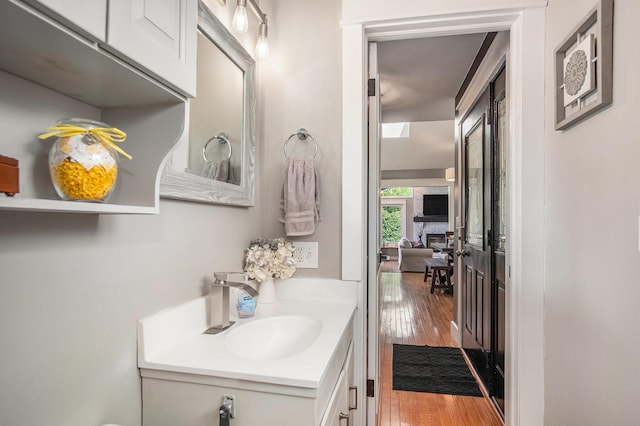 1836 Ridgewood Ave SE, Grand Rapids, MI 49506 - half bathroom with vanity and wood finished floors
