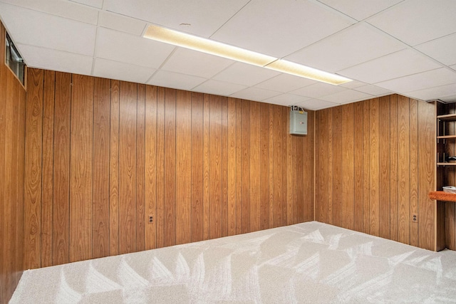 1836 Ridgewood Ave SE, Grand Rapids, MI 49506 - finished basement with a paneled ceiling, wooden walls, and carpet flooring