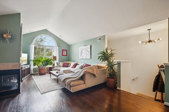 3197 Primrose Ln, Ypsilanti, MI 48197 - living room with vaulted ceiling, hardwood / wood-style flooring, a chandelier, and a fireplace