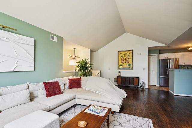 3197 Primrose Ln, Ypsilanti, MI 48197 - living room featuring wood finished floors, lofted ceiling, and a chandelier